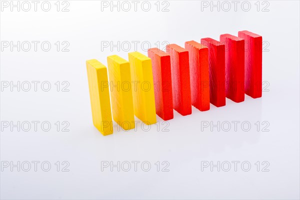 Colorful Domino Blocks in a line on a white background