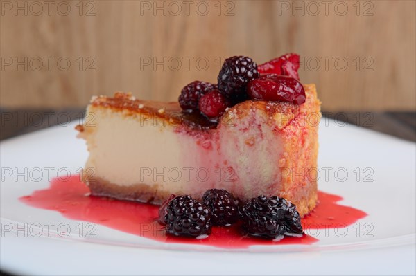 Piece of cheesecake with cherry