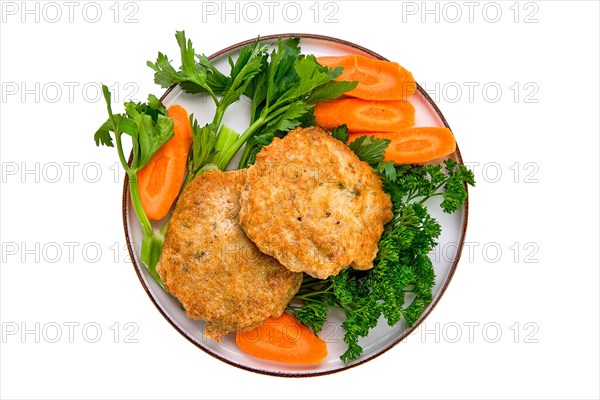 Fried beef cutlet in breading with fresh carrot isolated on white