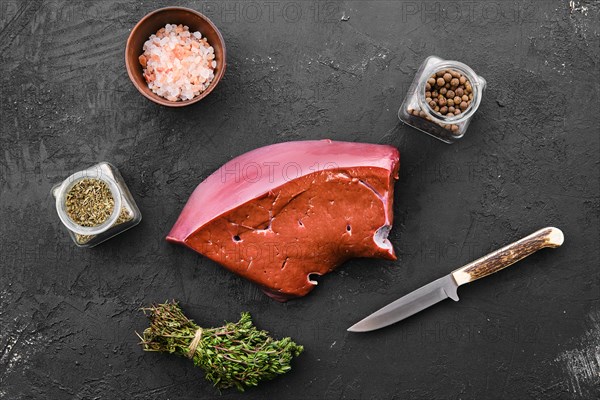 Raw fresh beef liver with spice and herbs