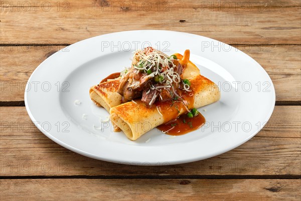Thin pancakes stuffed with beef and mushrooms