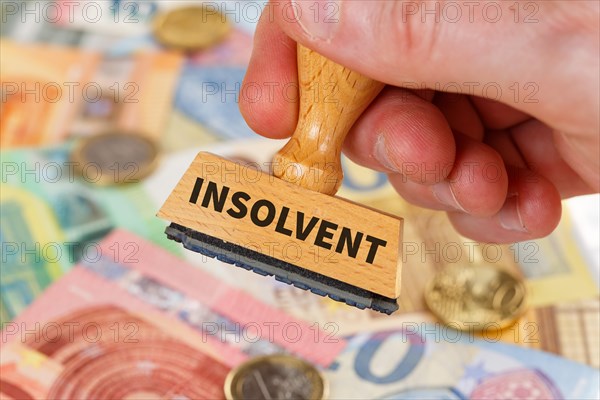 Insolvent on stamp symbol image insolvency bankruptcy debt finance and economy money crisis as business concept in Stuttgart