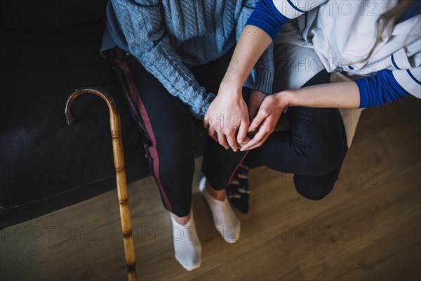 Retirement home concept with nurse woman holding hands. Resolution and high quality beautiful photo