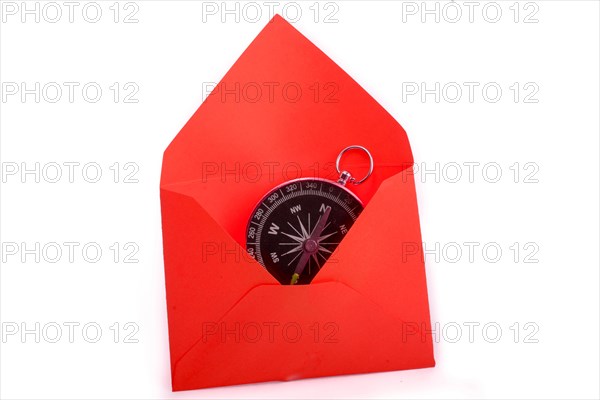 Compass in a an envelope on a white background