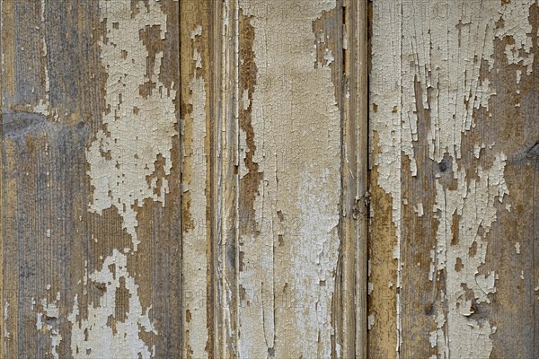 Abstract wooden background. Cracked paint on the wall