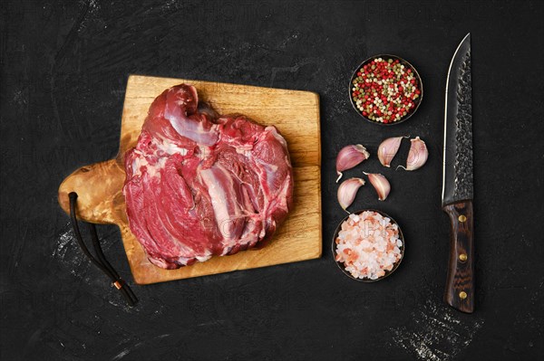 Top view of raw lamb cump ready for cooking on the kitchen table