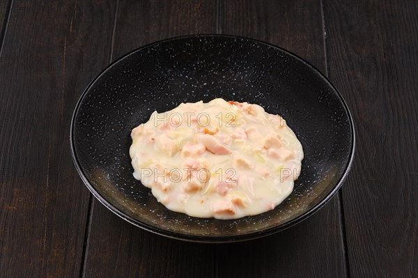 Ham and bacon with onion with creamy bechamel sauce