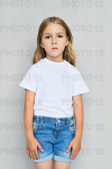 Little child girl in white t-shirt