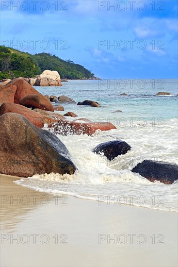 Beach and rocks of Anse Lazio in the evening