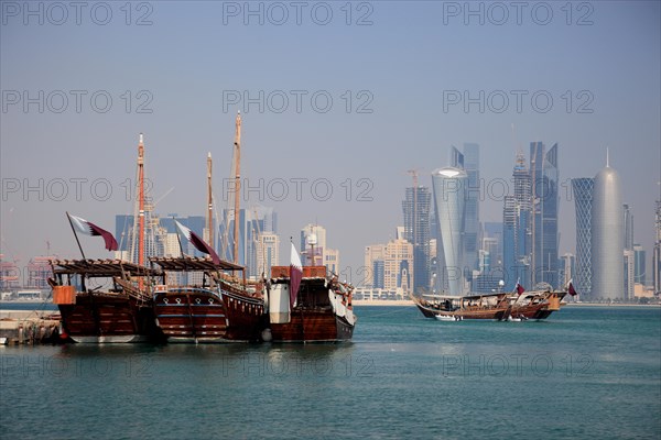 Fishing boats in front of the skyline of Doha