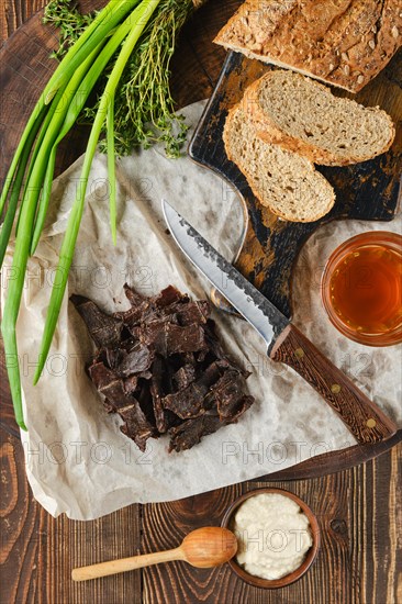 Overhead view of heap of jerky venison as a snack