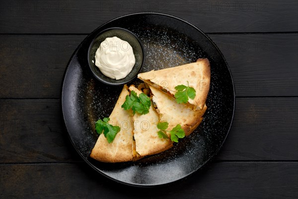 Top view of quesadilla with chicken meat