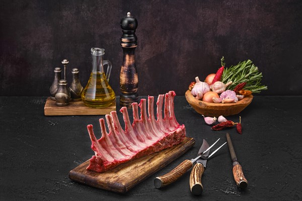 Raw fresh rack of lamb on kitchen table