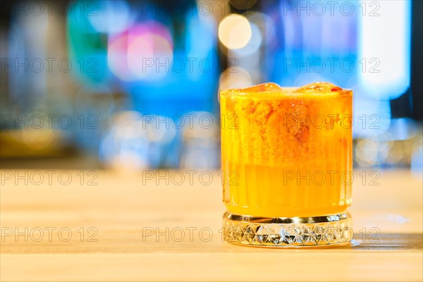 Cold cocktail with tequila and sea buckthorn