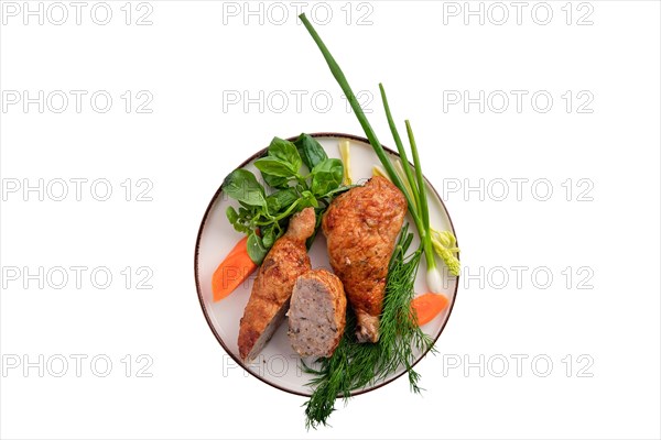 Stuffed chicken thigh decorated with spring onion