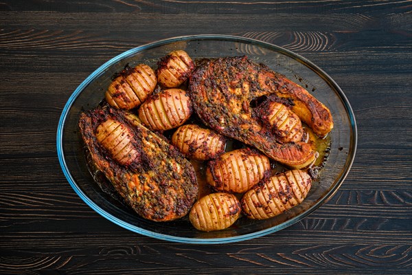 Baked salmon steak with hasselback potatoes