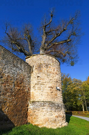Outer wall with corner tower of medieval fortress called Burg Steinsberg in German city Sinsheim