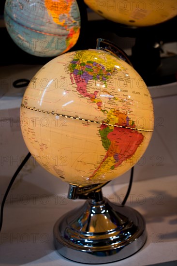 Little colorful model globe with maps on it