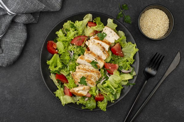 Flat lay salad with chicken sesame seeds