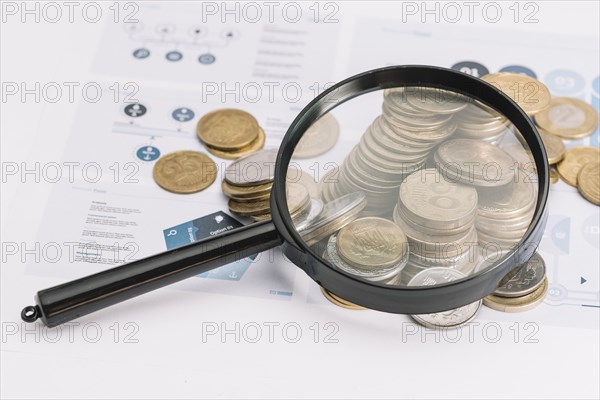 Magnifying glass fallen coins infographic template