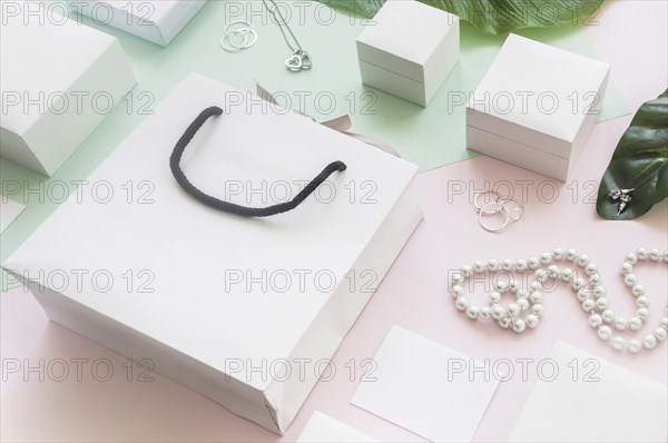 White shopping bag gift boxes with jewelry colored background. Resolution and high quality beautiful photo