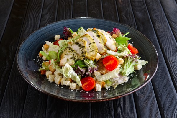 Salad with fried chicken fillet