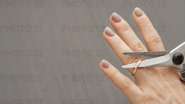 Top view scissors cutting wedding ring. Resolution and high quality beautiful photo