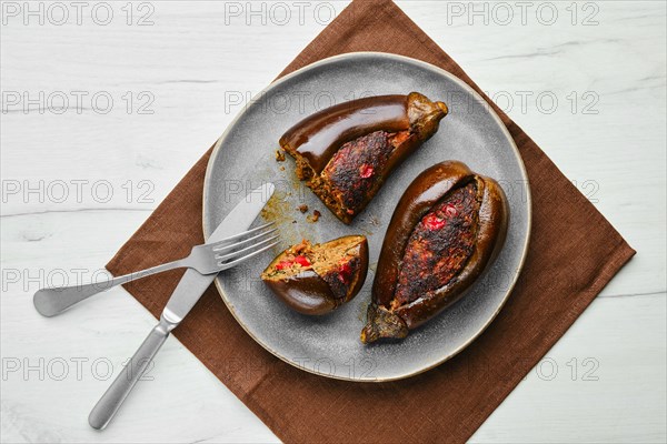 Overhead view of aubergine filled with meat and spice baked in oven