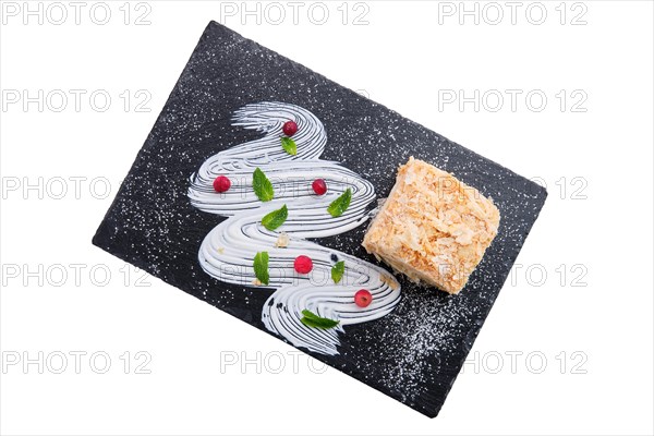 Napoleon cake on plate isolated on white background