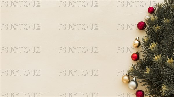 Green fir tree branches with baubles