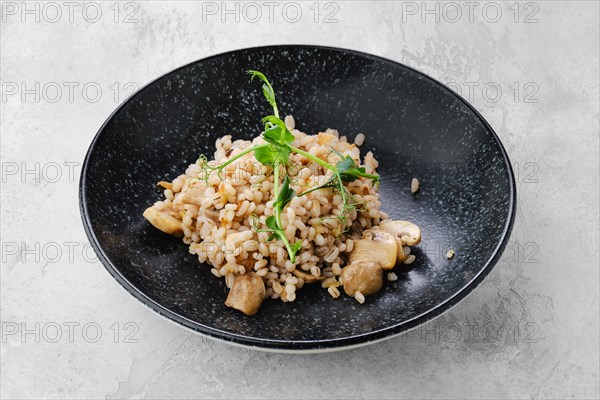 Boilet pearl barley with fried mushrooms