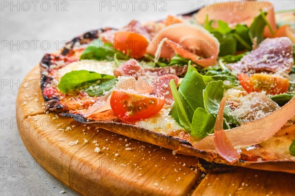 Thin-crust pizza dough with prosciutto