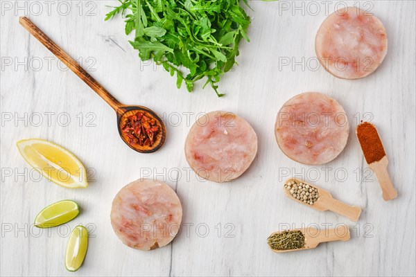 Frozen round fish cutlet with spice