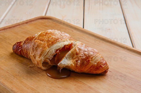 Teared croissant with flowing out chocolate filling