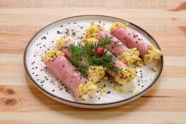 Delicious rolls made of ham stuffed with cheese