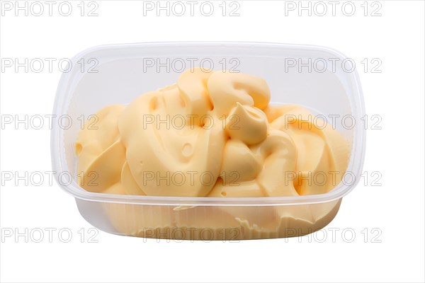 Portion of olive mayonnaise in take away packing isolated on white background