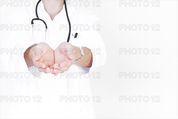 Close up doctor with cupped hands