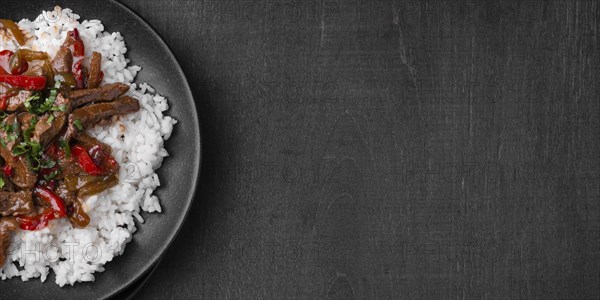 Flat lay of traditional asian rice dish with meat