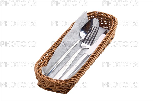 Set of cutlery in basket isolated on white background