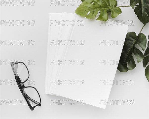 Top view book with glasses leaves desk. Resolution and high quality beautiful photo