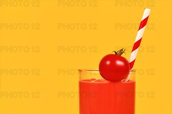 Glass with red tomato juice