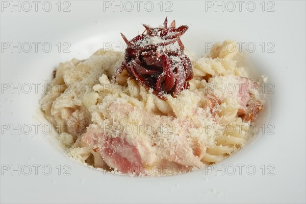 Close up of pasta with salmon and onion marmalade