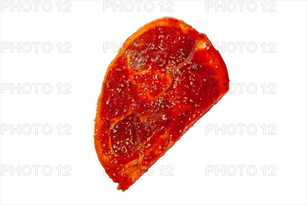 Raw piece of meat with spice and sauce prepered for barbecue. Gastronomy template isolated on white background