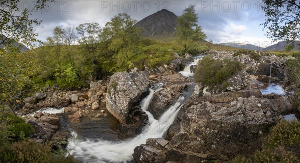 Waterfalls in front of mountain range Buachaille Etive Mor