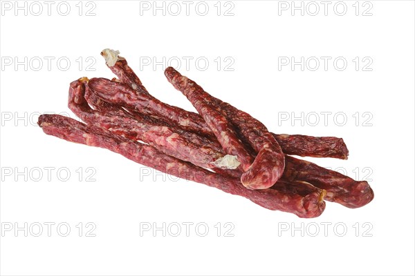 Air dried deer and pork sausage isolated on white background