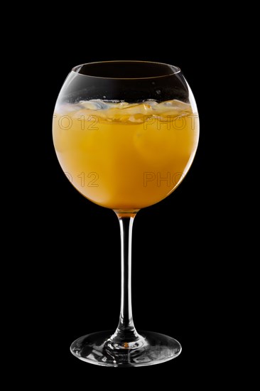 Cold sangria in wine glass isolated on black background