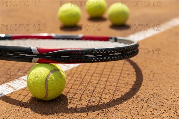 Close up tennis racket ball