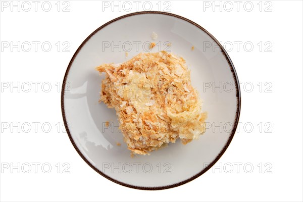 Napoleon cake on plate isolated on white background