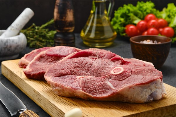 Close up view of lamb steaks with spice