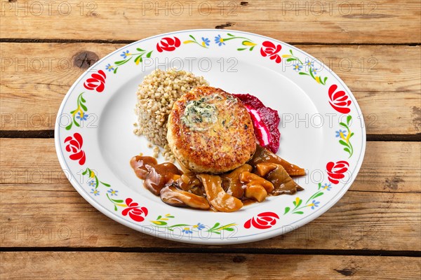 Meat cutlet with honey mushroom and green buckwheat